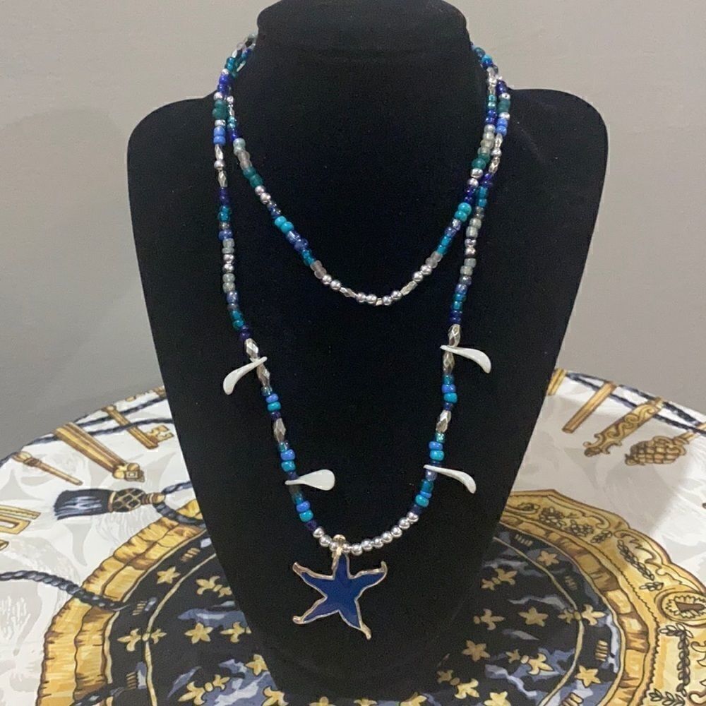 Beaded wrap necklace with shell & star accents.